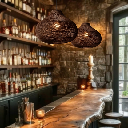 Textured rattan pendant light creating a cozy, moody, and sophisticated atmosphere in a wine cellar.