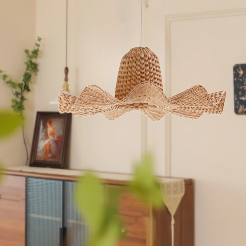 A beautiful hand-woven rattan pendant light creating a relaxing, luxury atmosphere at a tropical beachfront resort.