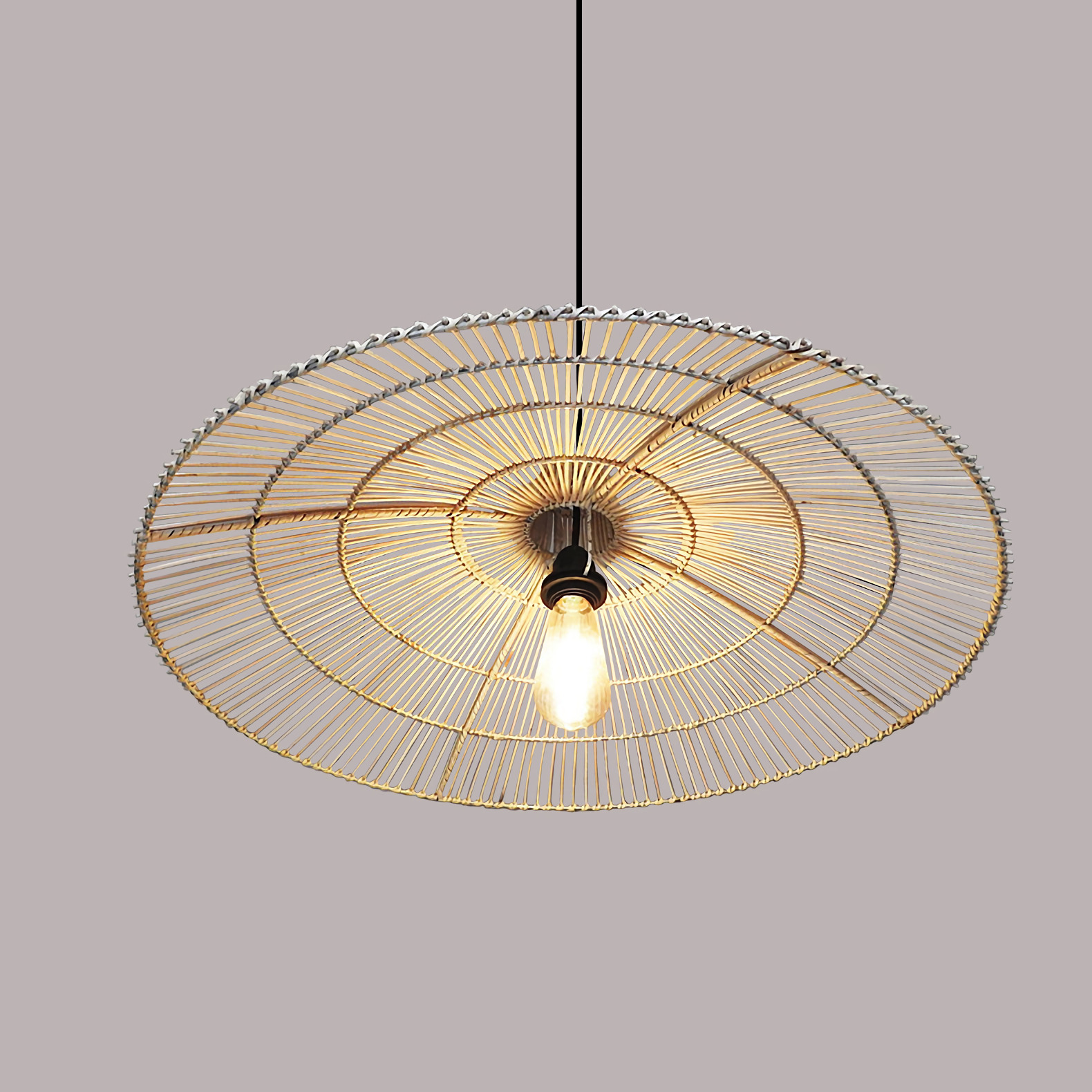 Unbleached, pure rattan cone pendant, capturing a raw, authentic, and minimalist aesthetic.