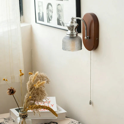 Sustainable material artisan hand-finished wood and glass sconce delivering relaxing wellness vibes in a resort spa.