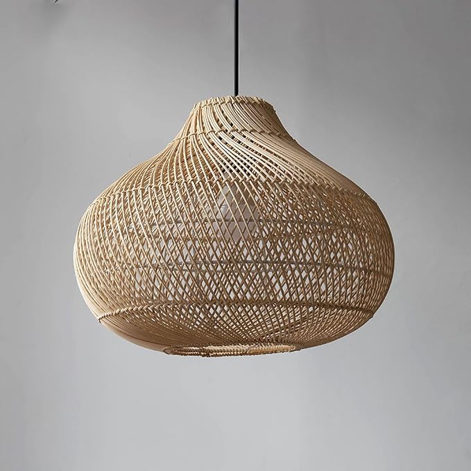 Boho chic hanging lights made of natural fibers illuminating a patio space.