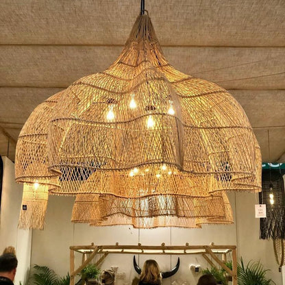 Stylish boho chic wicker pendant lamp with a unique flower design, creating artistic shadows for modern interior spaces.