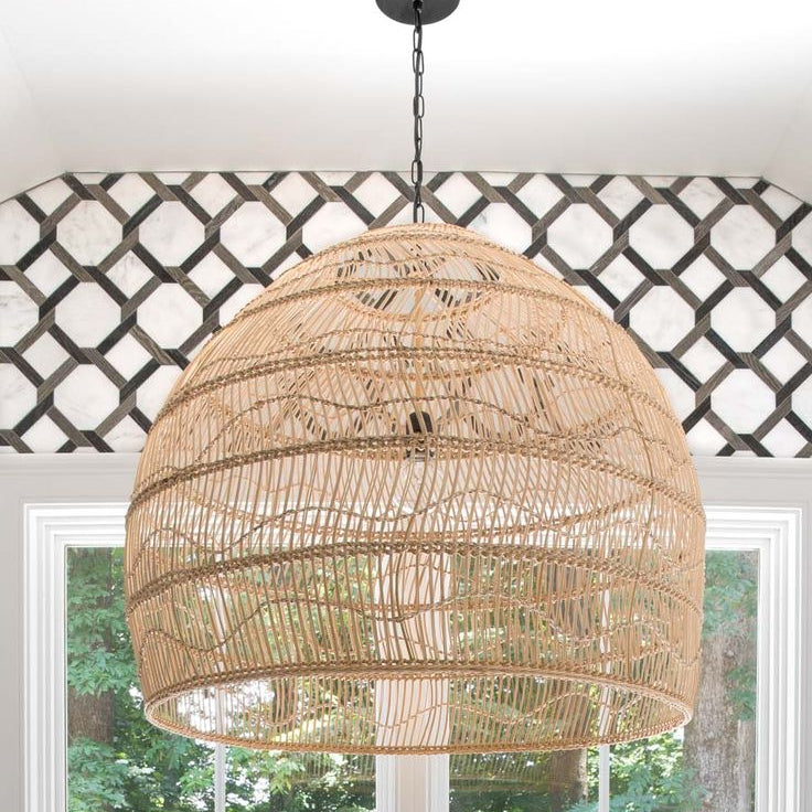 Boho chic restaurant decor with oversized woven bamboo chandeliers and elegant white cabinetry.