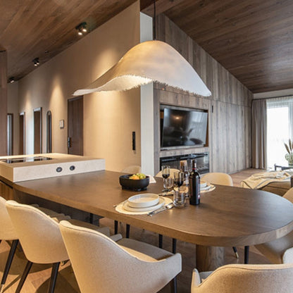 Contemporary artistic hanging light with frayed edge accents