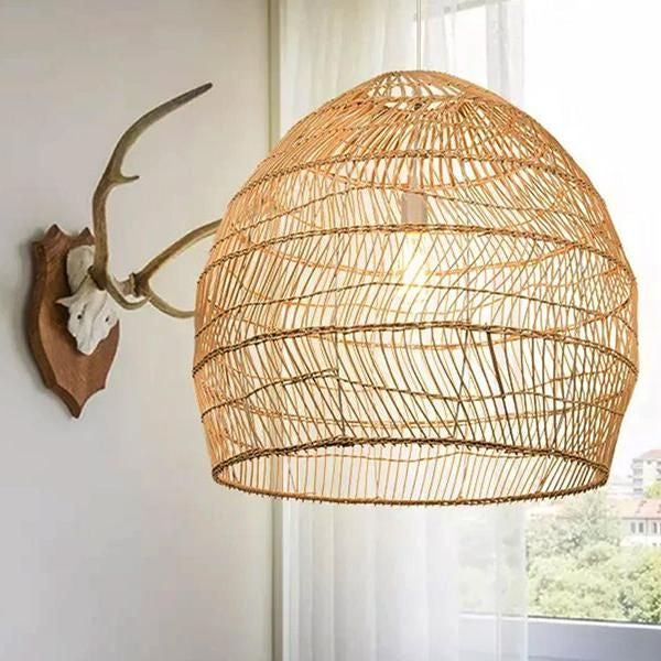 Cozy cafe interior design featuring warm lighting, large wicker lamp shades, and a rustic bar counter.
