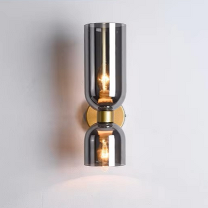 Art decor inspired copper and glass drop light serving as a striking architectural accent in a home hallway.