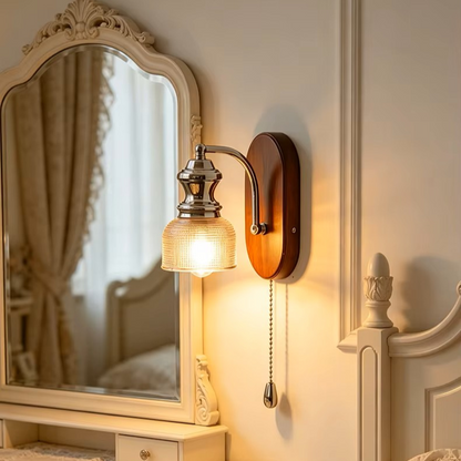 Health-conscious natural wood and glass wall lamp emitting a safe, toxin-free ambient glow in a cozy bedroom.