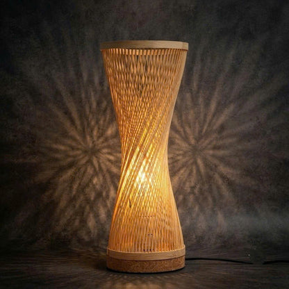 Handmade bamboo table lamp showcasing intricate artisan craftsmanship as a sustainable lighting decor piece.