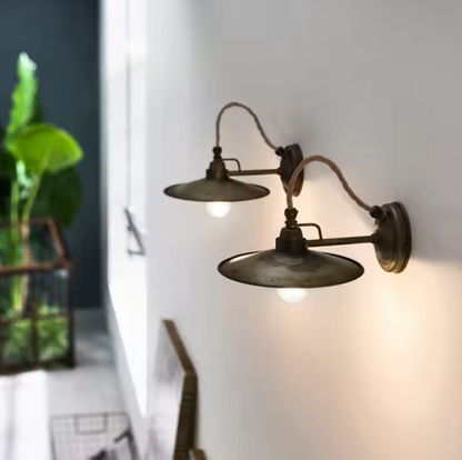 Japandi industrial wall light merging minimalist layout with rugged metal and iron textures.