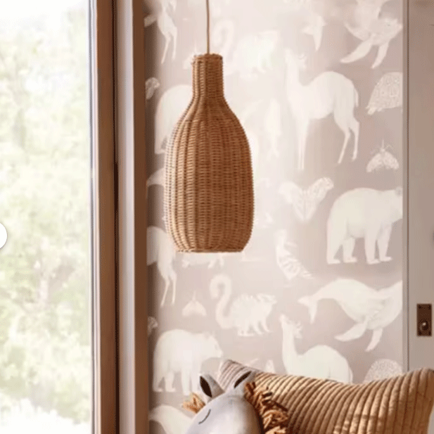 Minimalist rattan pendant lights providing soft, ambient light over a dining setting.