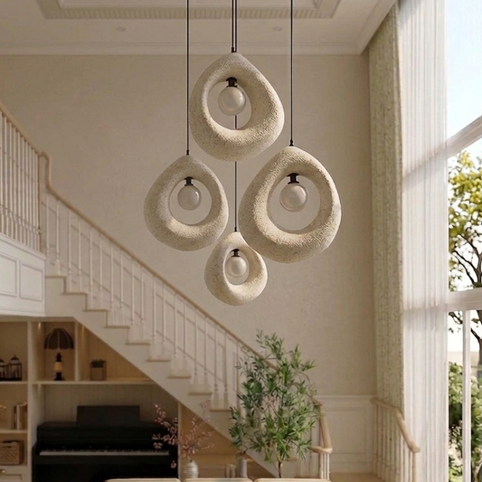 Modern artistic light fixture centered in a minimalist living room