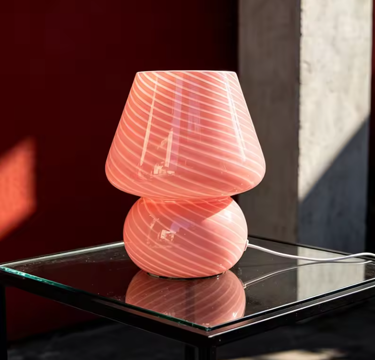 Cozy home style pink striped glass mushroom table lamp with soft pastel tones to brighten up bedside and accent tables.