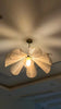 Pendant light in Modern style, crafted from Fabric, ideal for Living room decor, providing ambient and mood lighting with an organic, sculptural appeal.