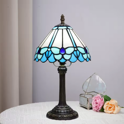 Vintage retro style stained glass lamp with a classic grape harvest pattern, serving as a statement piece for hallway console tables.
