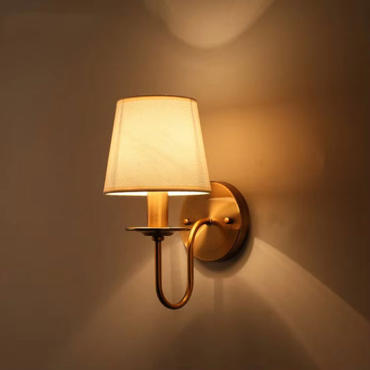 Eco-friendly natural iron and cloth wall sconce handcrafted with sustainable materials for an organic modern living room.
