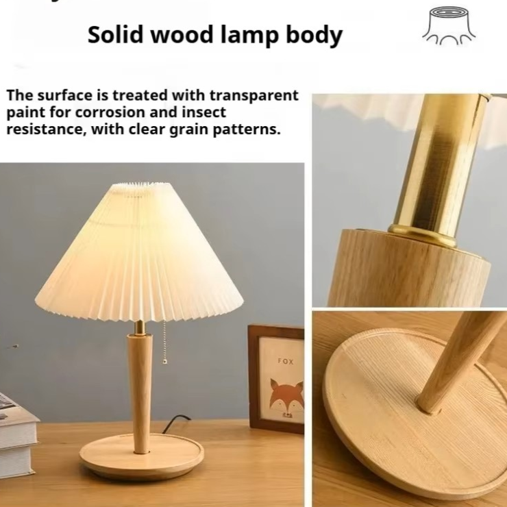 Solid wood table lamp with a pleated cream shade, light natural wood stem and base, and a gold-toned metal neck, shown on a desk with close-up detail views and explanatory text about the transparent-painted wood finish.