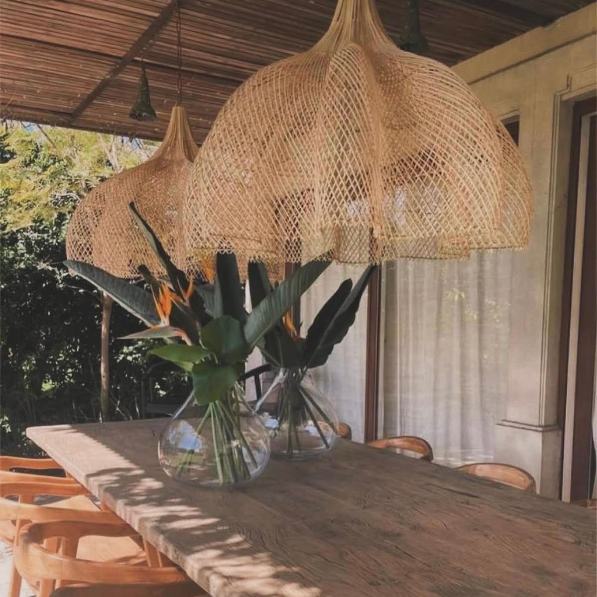Decorative woven floral rattan ceiling light fixture providing warm ambient lighting for bedrooms and living rooms.